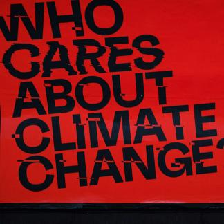 Who Cares About Climate Change? written across a red background